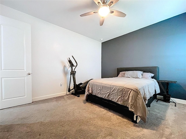 carpeted bedroom featuring a ceiling fan and baseboards