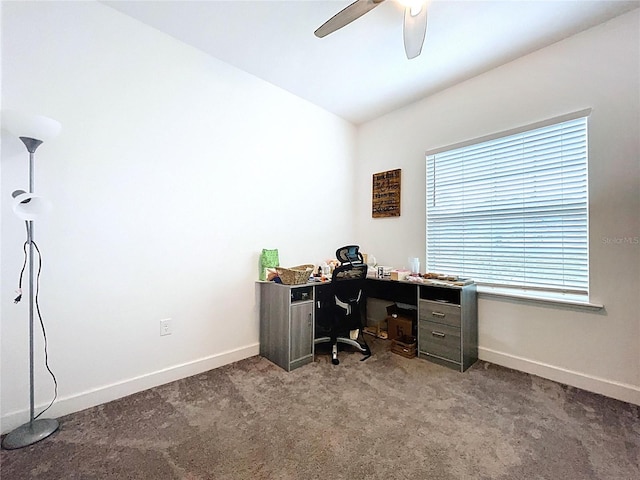 office space with carpet floors, ceiling fan, baseboards, and lofted ceiling