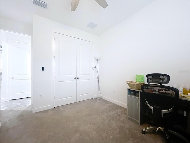 office area featuring carpet floors, lofted ceiling, visible vents, and baseboards