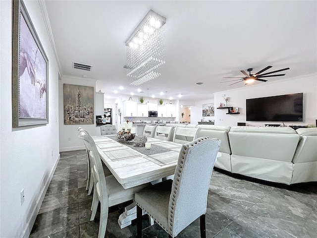 dining area featuring ornamental molding, visible vents, and baseboards