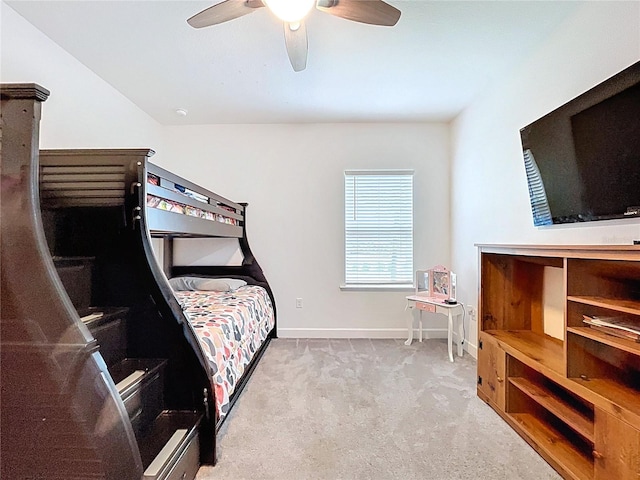 bedroom featuring carpet floors, baseboards, and a ceiling fan