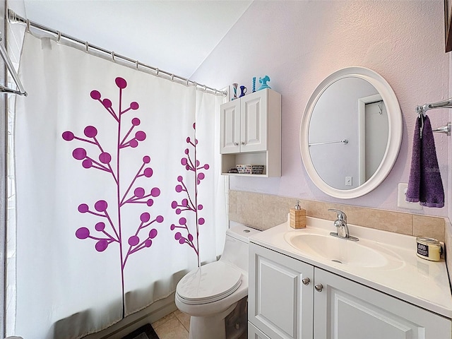 bathroom with vanity, shower / bath combination with curtain, and toilet