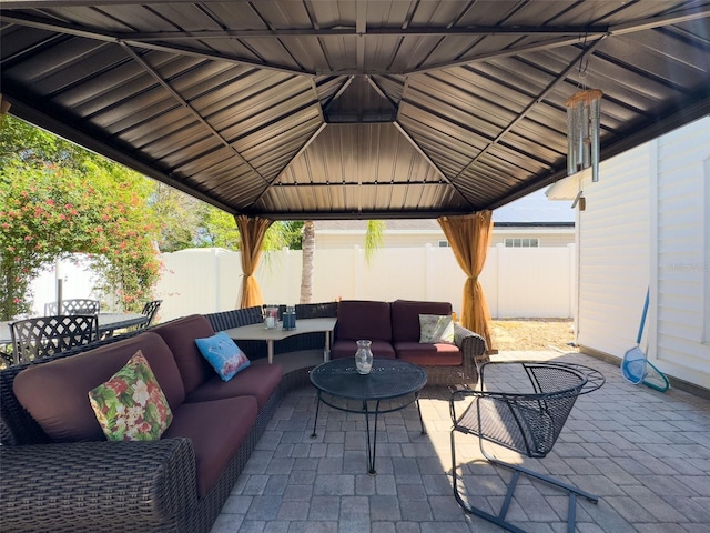 view of patio / terrace with a gazebo, outdoor dining space, outdoor lounge area, and a fenced backyard