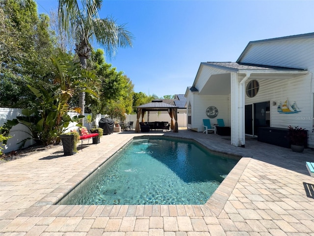 outdoor pool featuring a gazebo, a patio area, and a fenced backyard