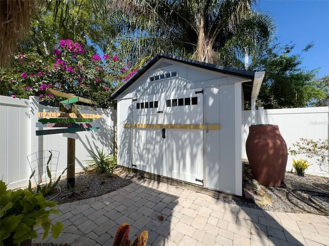 view of shed featuring a fenced backyard