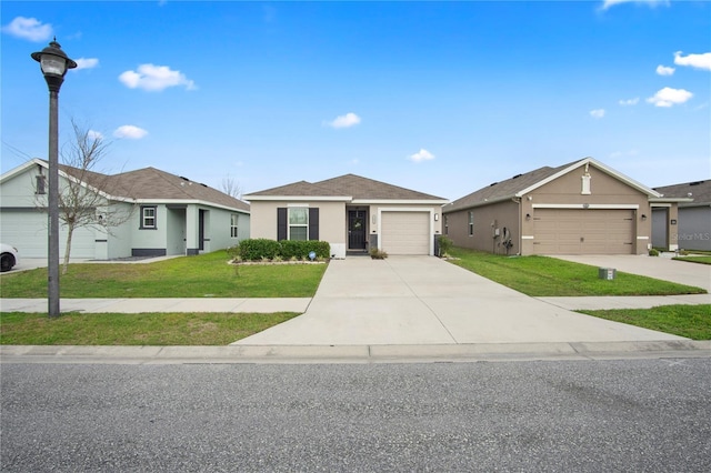 single story home featuring an attached garage, concrete driveway, a front yard, and stucco siding