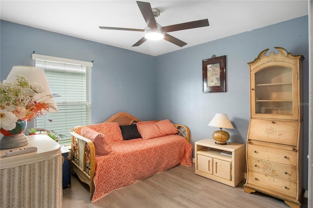 bedroom with light wood-style floors and ceiling fan