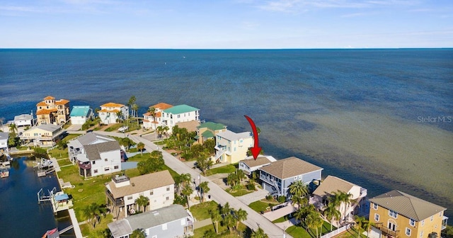 bird's eye view with a residential view and a water view