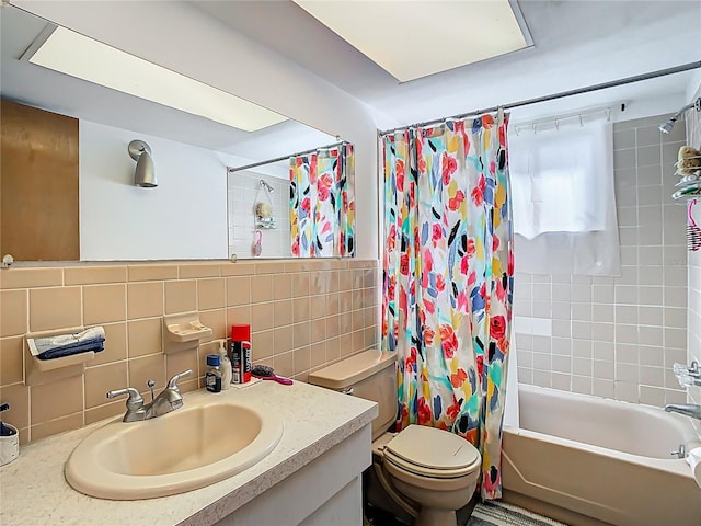 full bath with decorative backsplash, toilet, shower / tub combo with curtain, vanity, and tile walls