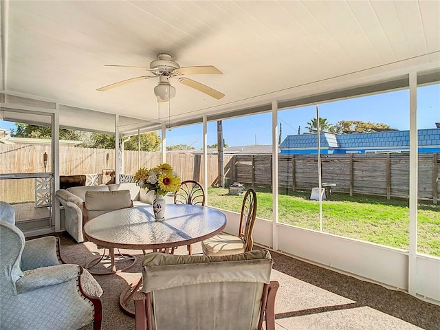 sunroom / solarium with ceiling fan