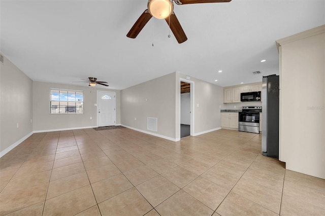 unfurnished living room with light tile patterned floors, visible vents, baseboards, and recessed lighting