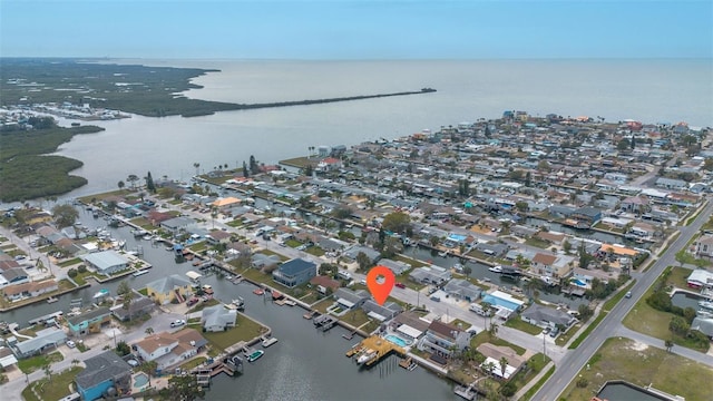 birds eye view of property featuring a residential view and a water view