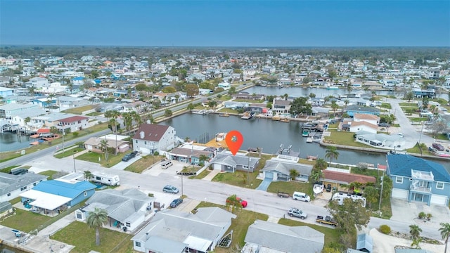 bird's eye view with a residential view and a water view