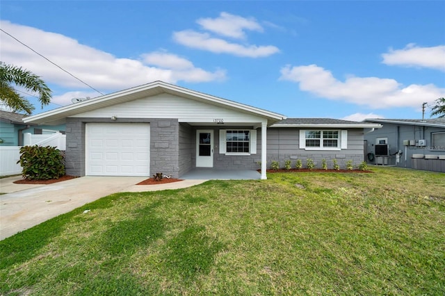 single story home featuring a front lawn, fence, a garage, and driveway