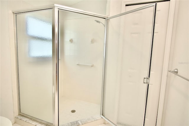 bathroom with a stall shower