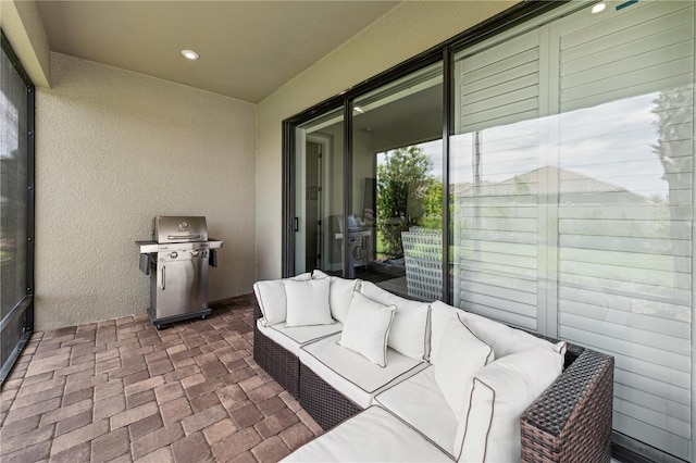 view of patio with an outdoor living space and area for grilling