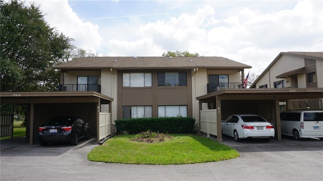 view of front of home with covered parking and stucco siding