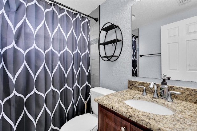 full bath featuring visible vents, toilet, curtained shower, vanity, and a textured wall