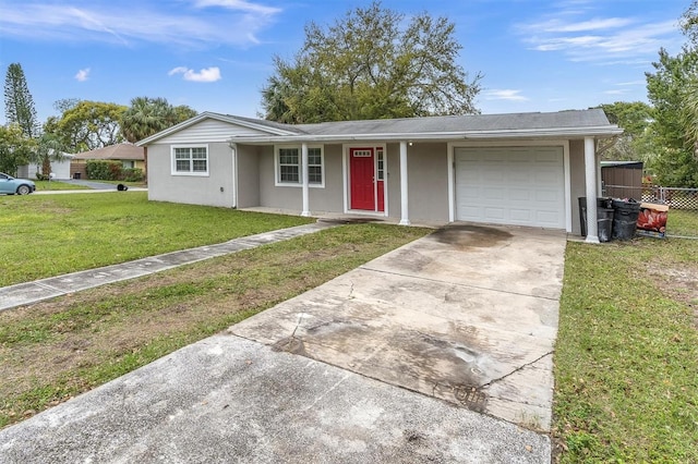 single story home featuring a front yard, fence, driveway, stucco siding, and a garage