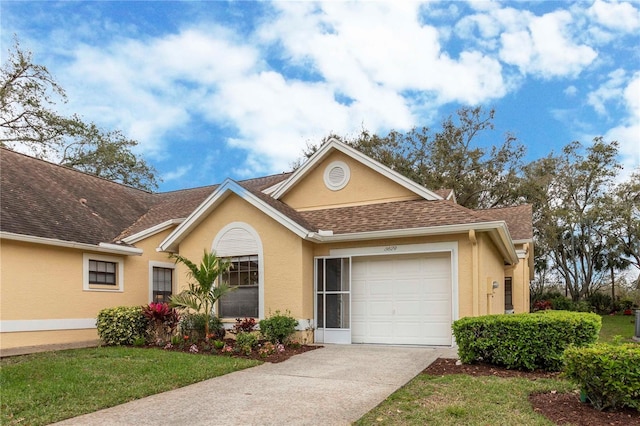 single story home featuring concrete driveway, roof with shingles, an attached garage, and stucco siding