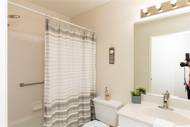 full bathroom featuring a textured ceiling, shower / bath combination with curtain, vanity, and toilet