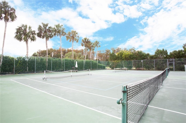 view of sport court with fence