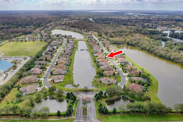 bird's eye view featuring a residential view and a water view