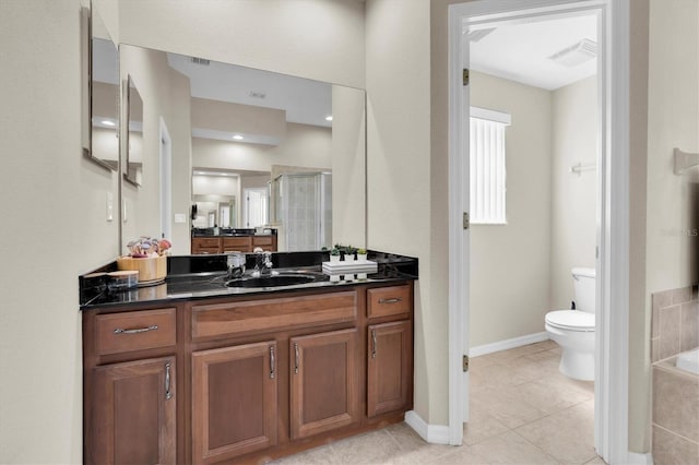 bathroom with tile patterned floors, visible vents, toilet, a stall shower, and vanity