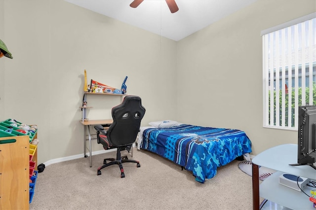 bedroom featuring a ceiling fan, carpet, and baseboards