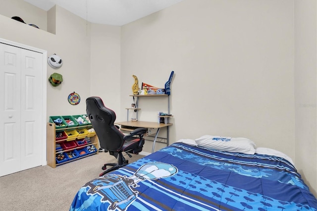 bedroom with a closet and carpet