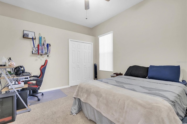 bedroom featuring a closet, carpet floors, baseboards, and ceiling fan