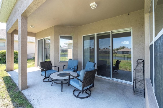 view of patio / terrace featuring fence