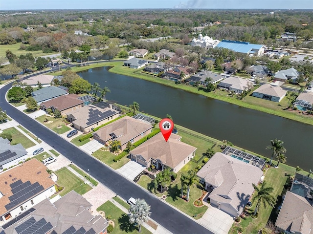 bird's eye view featuring a residential view and a water view