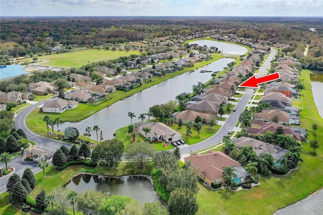 aerial view with a residential view and a water view