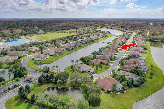 aerial view with a residential view and a water view