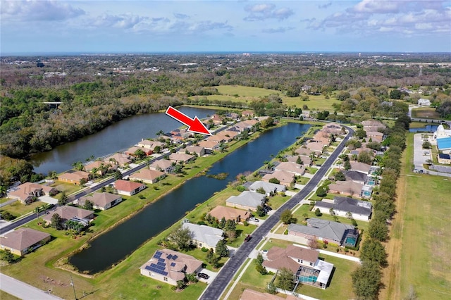 bird's eye view featuring a residential view and a water view