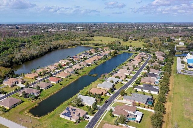 aerial view with a residential view and a water view