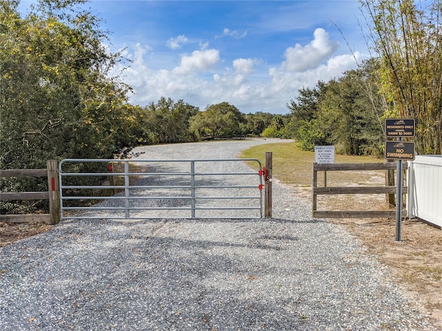 view of gate featuring fence