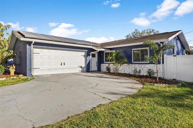 ranch-style house featuring solar panels, concrete driveway, an attached garage, and stucco siding