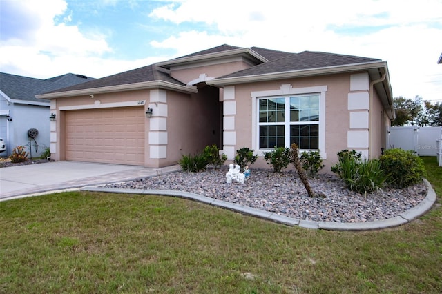 view of front of home featuring a garage, a shingled roof, driveway, stucco siding, and a front yard