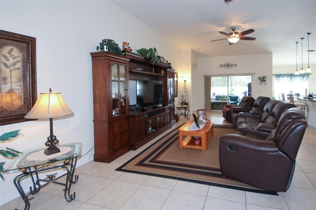 living area with ceiling fan and light tile patterned floors