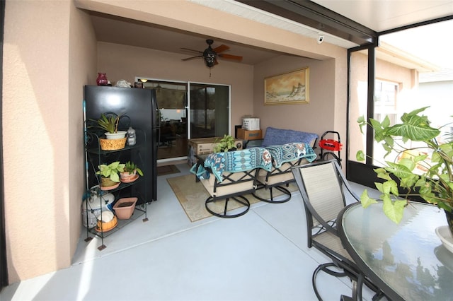 view of patio featuring ceiling fan