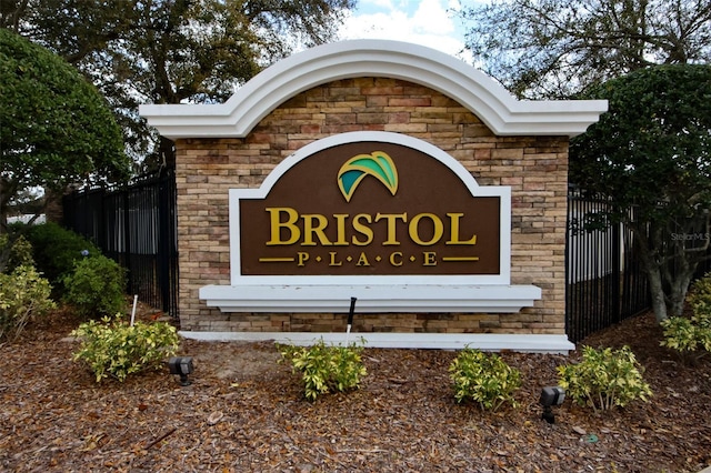 community sign featuring fence