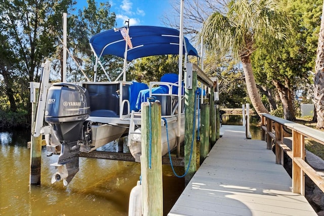 view of dock with a water view and boat lift