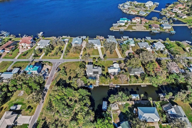 bird's eye view with a residential view and a water view