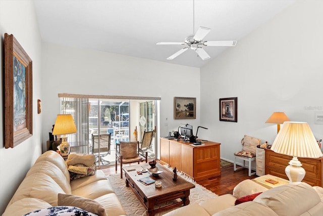 living room with lofted ceiling, ceiling fan, and wood finished floors