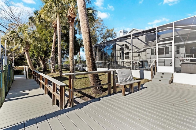 wooden deck featuring glass enclosure