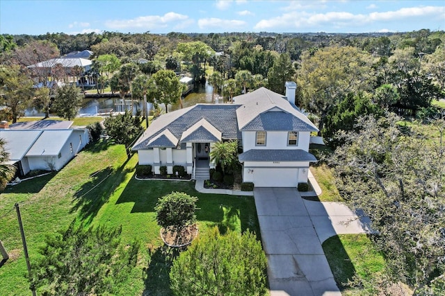 aerial view featuring a wooded view