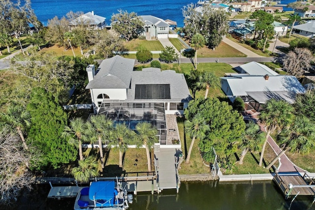 aerial view with a water view and a residential view