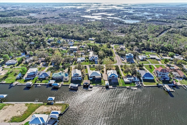 drone / aerial view featuring a water view and a residential view